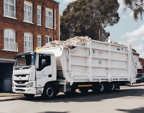 white truck used to transport skip bins, with a white skip bin on it_edited.jpg